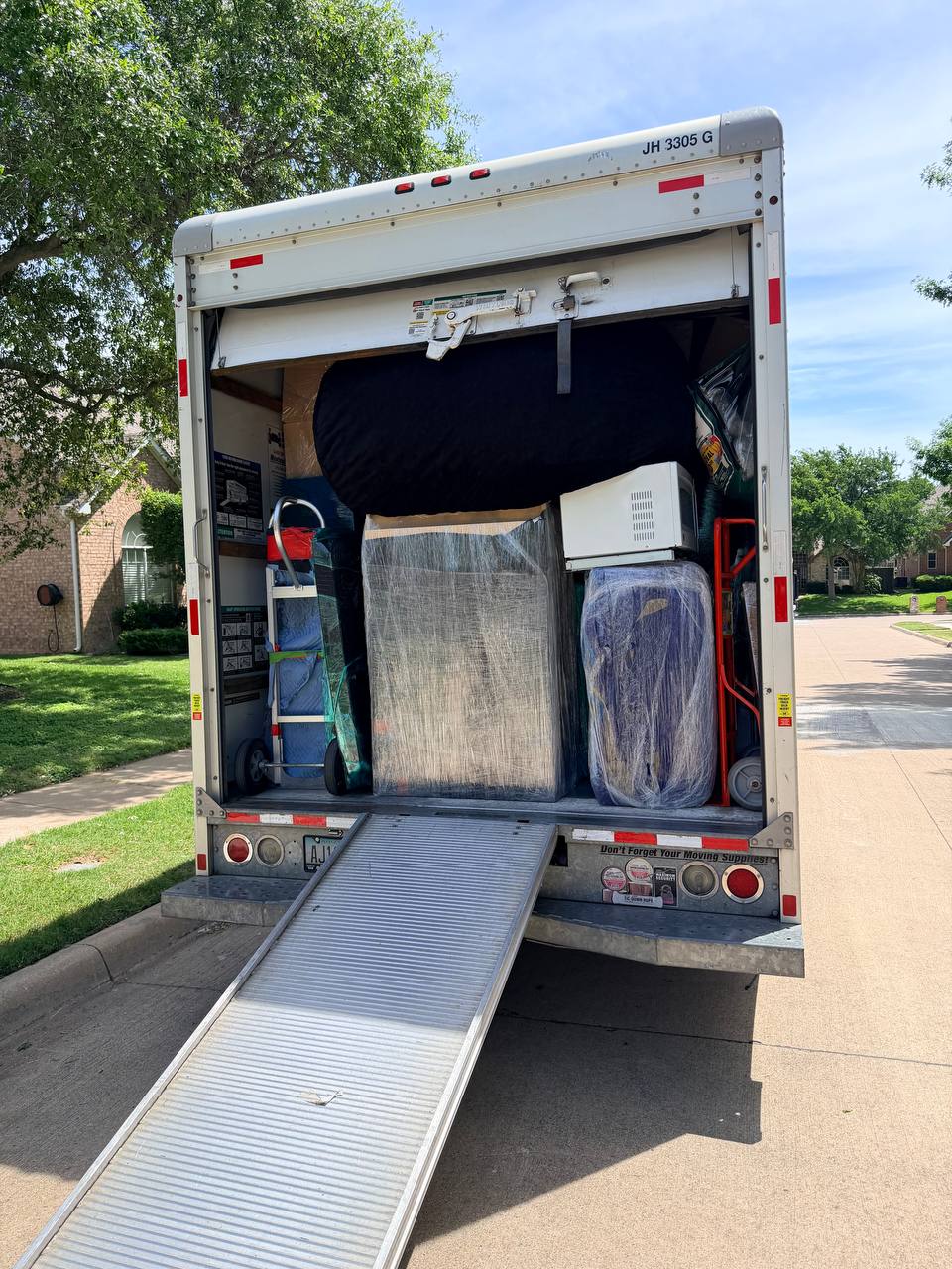 Pack-out truck loaded with wrapped and protected customer contents ready for off-site storage during water damage restoration